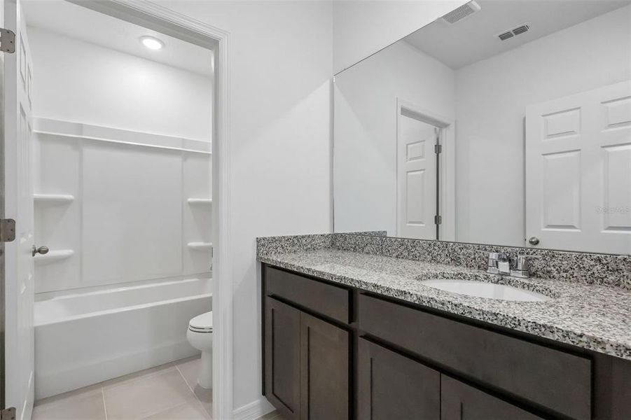 Furnished interior view inside a new home in Eagletail Landings, Howey-in-the-Hills (Image 9).