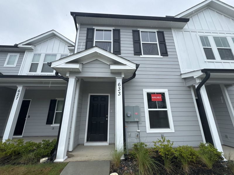 Front exterior of a new home in Forrest Bluff, North Augusta, SC, highlighting curb appeal (Image 2). Front exterior of a new home in Forrest Bluff, North Augusta, SC, highlighting curb appeal (Image 2).