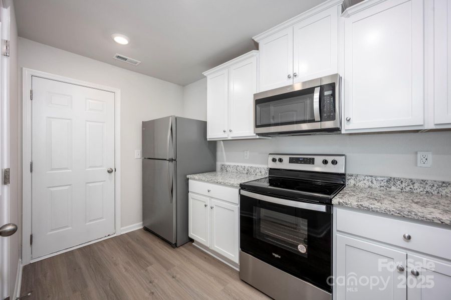 Furnished interior view inside a new home in McKee Creek Village, Charlotte (Image 5).