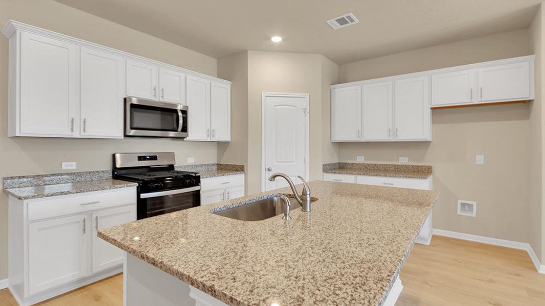 Furnished interior view inside a new home in Bar W Ranch, Leander (Image 5).