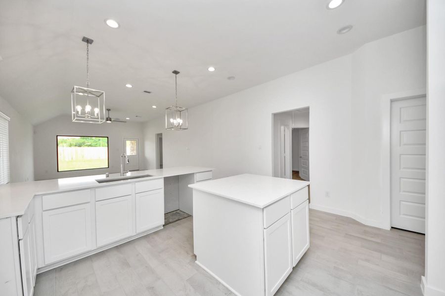 This generously spacious kitchen is a dream realized! Sample photo of completed home with similar floor plan. Actual colors and selections may vary. This generously spacious kitchen is a dream realized! Sample photo of completed home with similar floor plan. Actual colors and selections may vary.