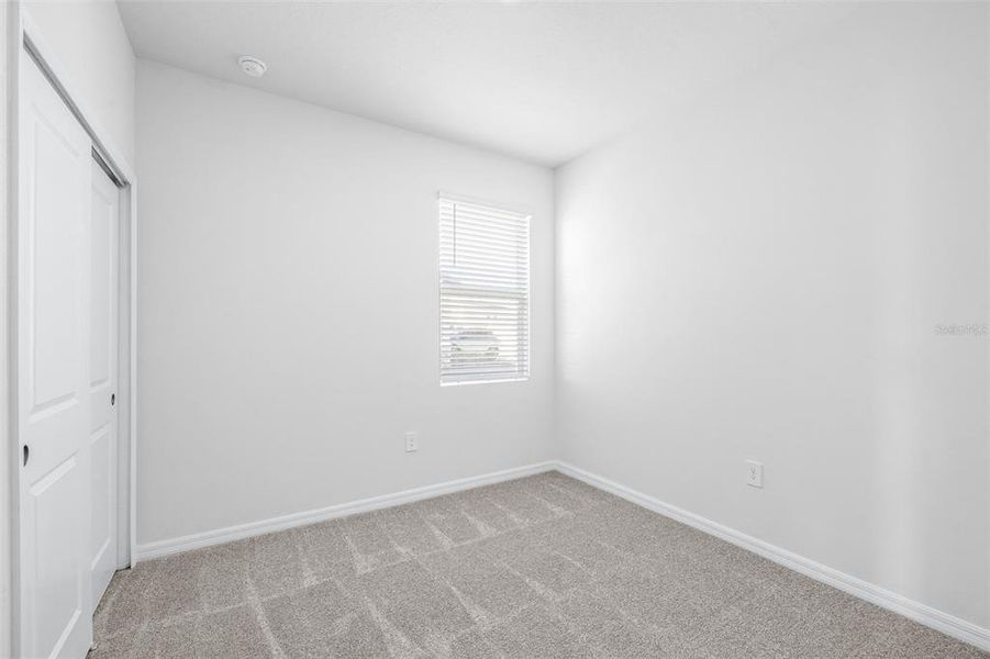 Spacious, unfurnished interior of a new home in The Grove at Stuart Crossing - Premier Series, Bartow (Image 27).