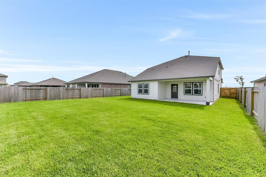 Front exterior of a new home in River Ranch Meadows, Dayton, TX, highlighting curb appeal (Image 23).