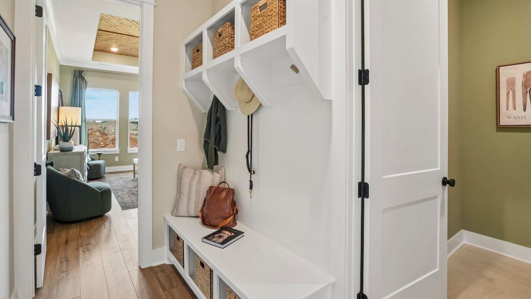 Dedicated drop-zone with access to laundry room and primary suite Dedicated drop-zone with access to laundry room and primary suite