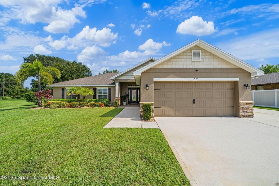 Front exterior of a new home in Palm Bay, Palm Bay, FL, highlighting curb appeal (Image 1).