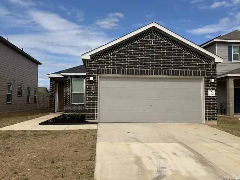Front exterior of a new home in Marbella, San Antonio, TX, highlighting curb appeal (Image 1). Front exterior of a new home in Marbella, San Antonio, TX, highlighting curb appeal (Image 1).