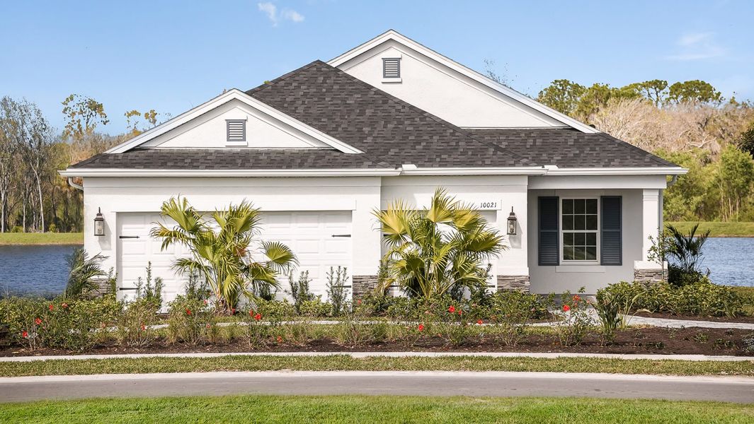Front exterior of a new home in Wildleaf, Parrish, FL, highlighting curb appeal (Image 29).