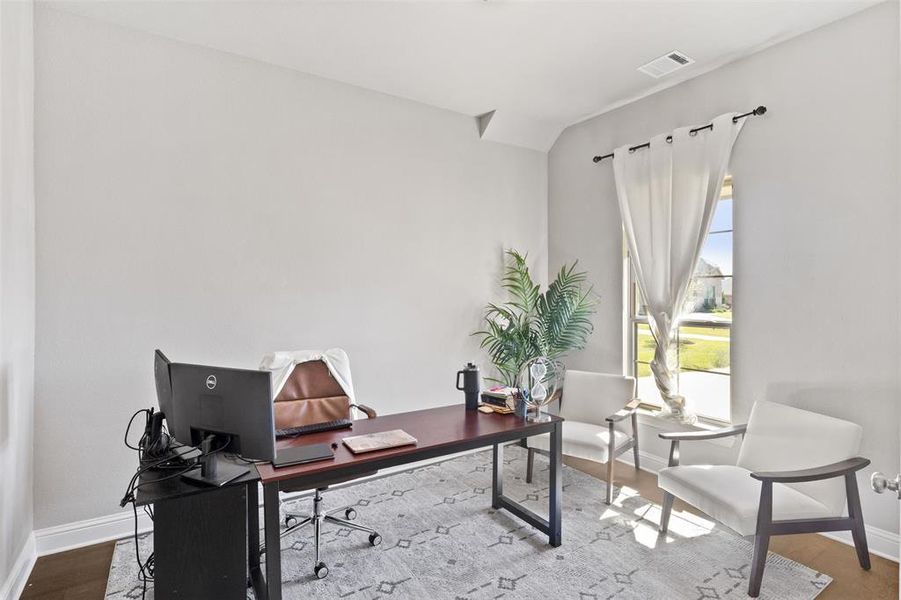 Home office featuring hardwood / wood-style flooring