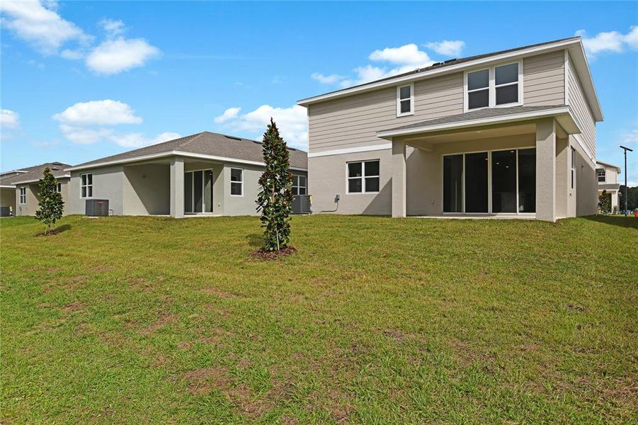 Exterior details and patio area of a home in Seasons at Aurora Oaks, Ocala (Image 16).