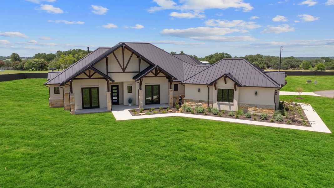 Front exterior of a new home in , Liberty Hill, TX, highlighting curb appeal (Image 2).