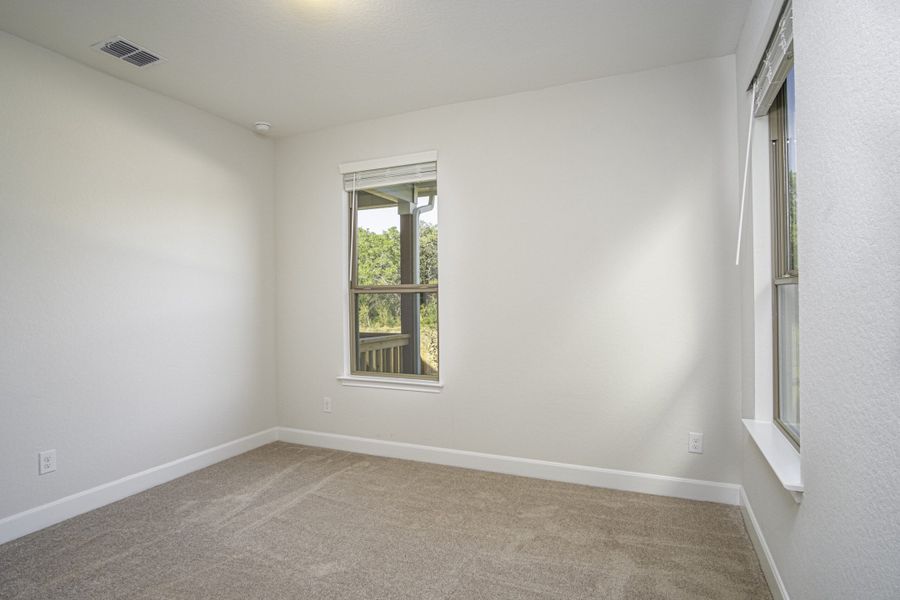 Representative unfurnished interior of a home built from the The Palmer by Rosehaven Homes in Magnolia Village, San Antonio (Image 15).