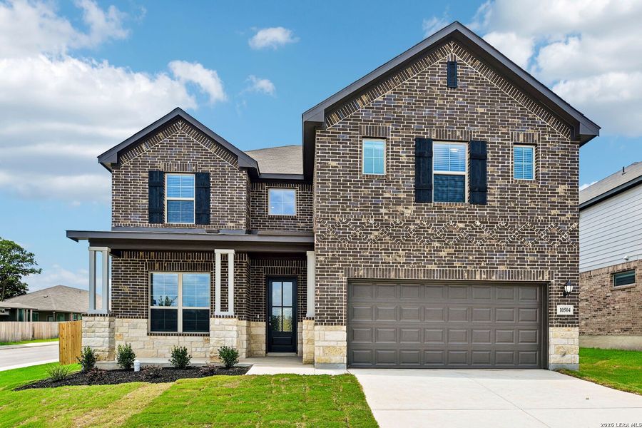 Front exterior of a new home in Fox Falls, Boerne, TX, highlighting curb appeal (Image 2). Front exterior of a new home in Fox Falls, Boerne, TX, highlighting curb appeal (Image 2).