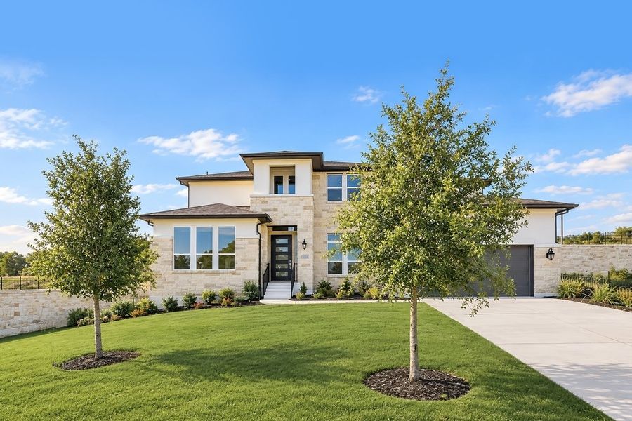 Front exterior of a new home in Travisso, Leander, TX, highlighting curb appeal (Image 14).