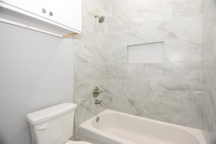 Second full bath with separate toilet and tub area Second full bath with separate toilet and tub area