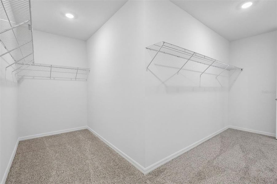 Spacious, unfurnished interior of a new home in The Grove at Stuart Crossing - Signature Series, Bartow (Image 33).