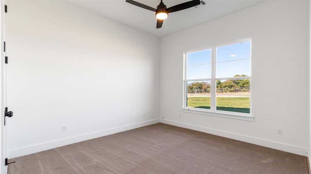 Unfurnished room with light carpet and ceiling fan