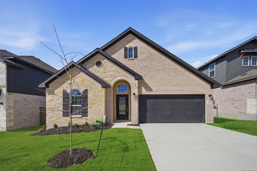Front exterior of a new home in The Woodlands at Medina Hills, Mico, TX, highlighting curb appeal (Image 23).