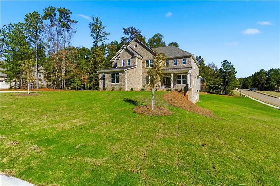 Front exterior of a new home in The Estates at Hurricane Pointe, Douglasville, GA, highlighting curb appeal (Image 25).