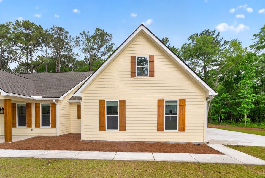 Front exterior of a new home in , Johns Island, SC, highlighting curb appeal (Image 21).
