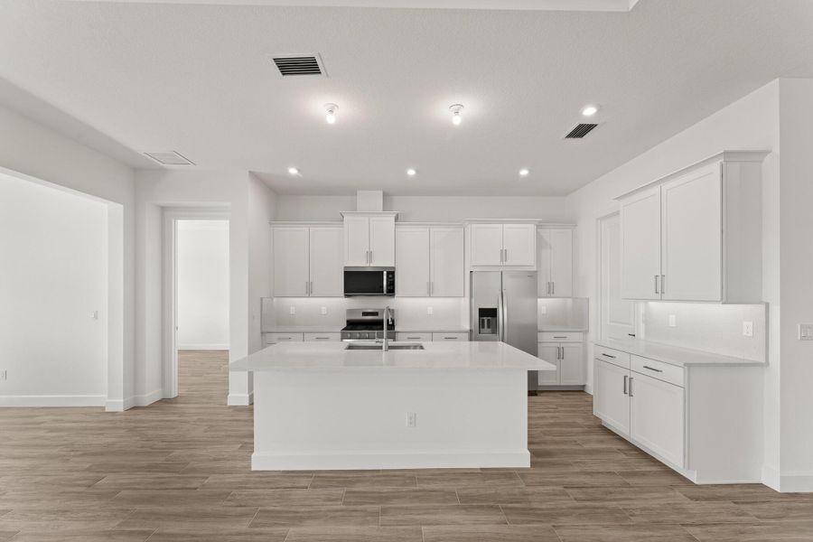 Furnished interior view inside a new home in Tradition - Seville, Port St. Lucie (Image 8). Furnished interior view inside a new home in Tradition - Seville, Port St. Lucie (Image 8).