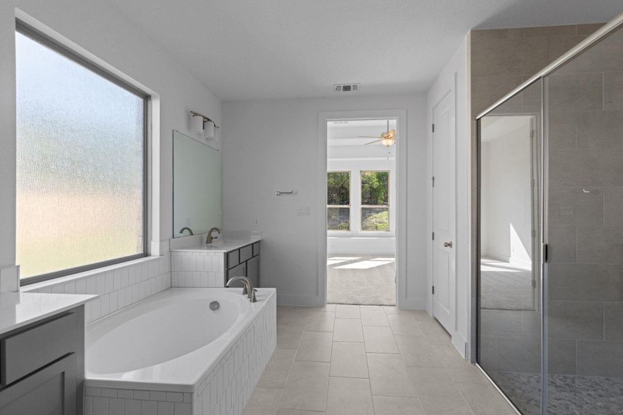 Primary Bath retreat with dual vanities & garden tub