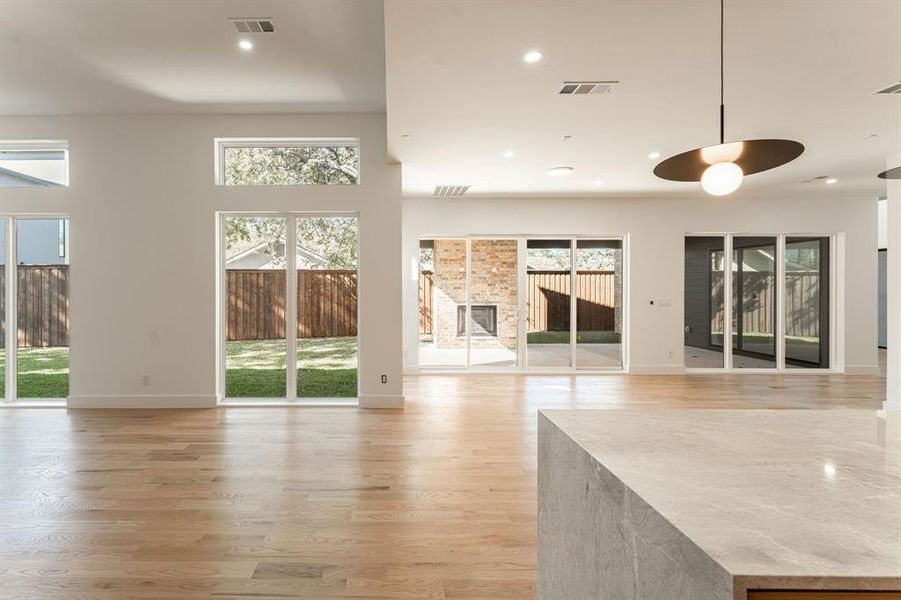 Unfurnished living room featuring light wood-type flooring