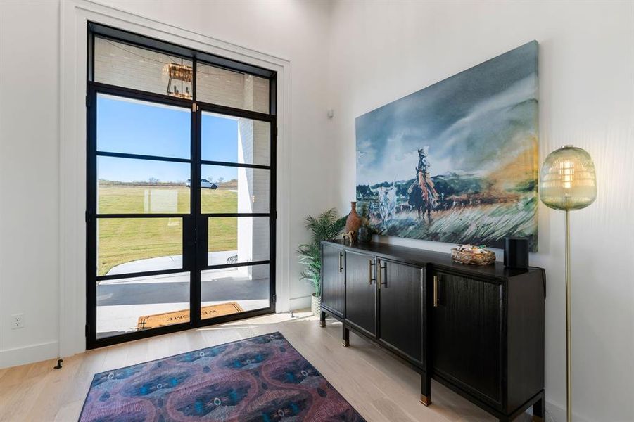 Entryway featuring wood finished floors and baseboards Entryway featuring wood finished floors and baseboards