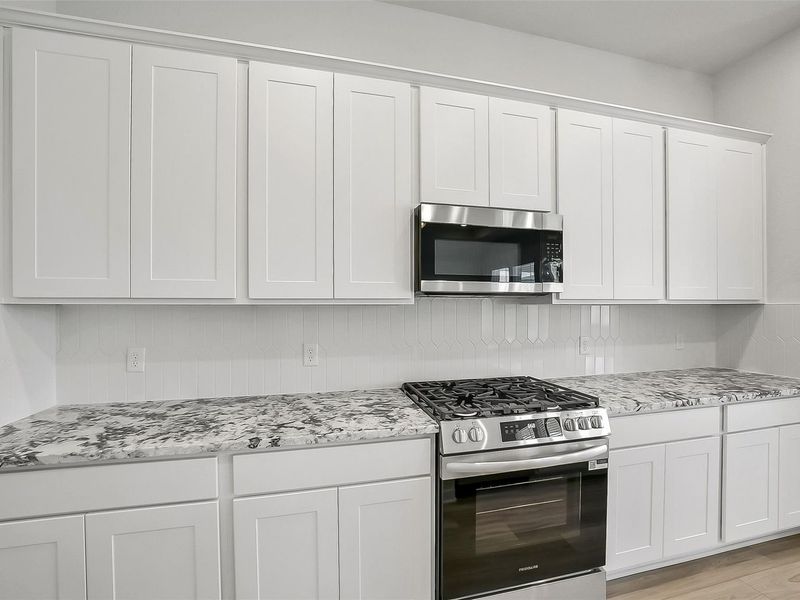 Furnished interior view inside a new home in Sunterra, Katy (Image 12).