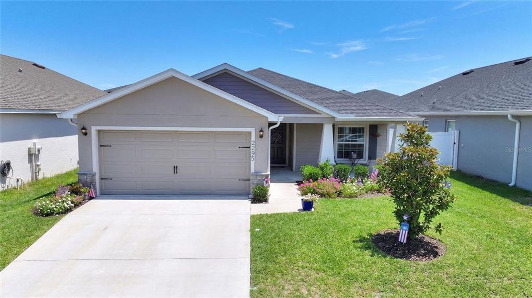 Front exterior of a new home in , Davenport, FL, highlighting curb appeal (Image 21). Front exterior of a new home in , Davenport, FL, highlighting curb appeal (Image 21).