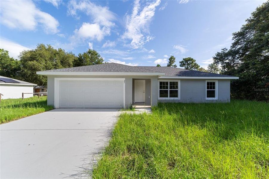 Front exterior of a new home in , Dunnellon, FL, highlighting curb appeal (Image 2). Front exterior of a new home in , Dunnellon, FL, highlighting curb appeal (Image 2).
