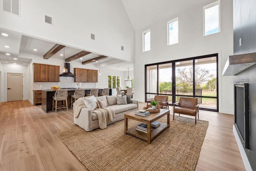 Stunning hickory wood floors grace every main living space — carpet-free for easy maintenance and timeless style.