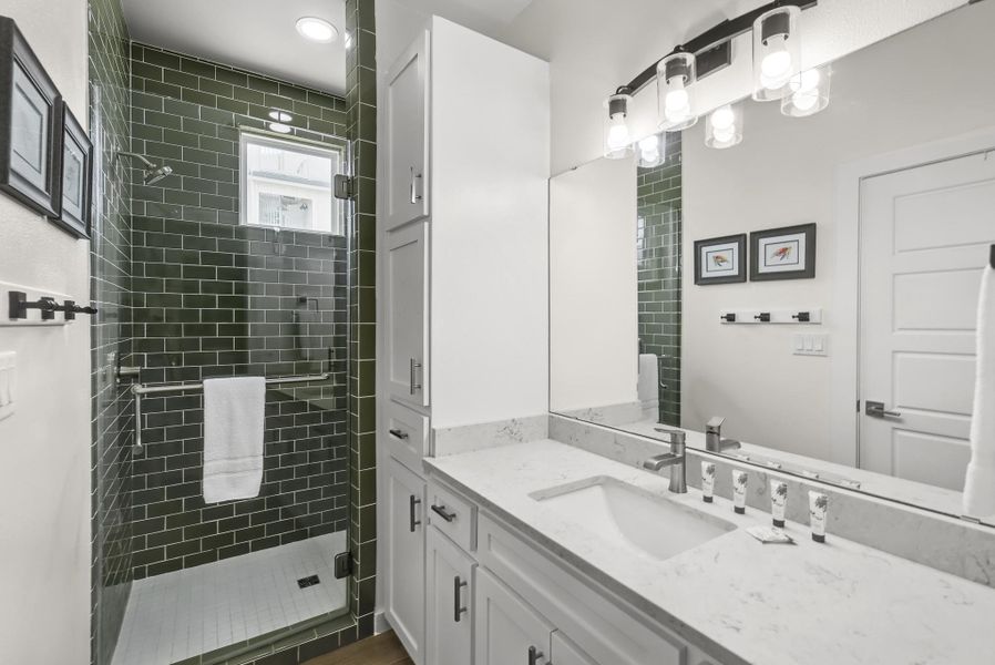 Full bathroom featuring vanity and a stall shower Full bathroom featuring vanity and a stall shower