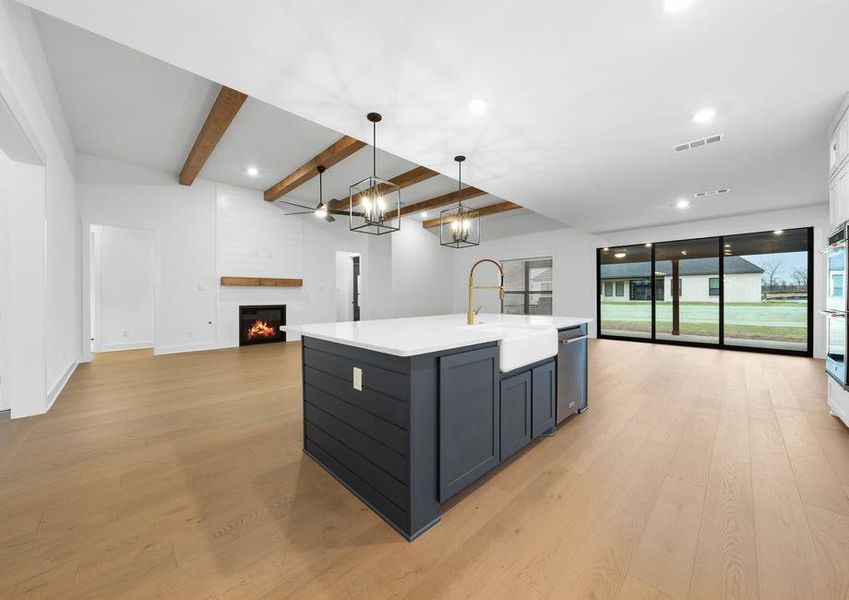 The open layout connects the kitchen with the breakfast area and family room.