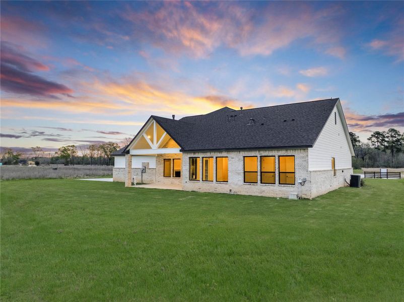 Exterior details and patio area of a home in High Meadow Estates, New Waverly (Image 4).