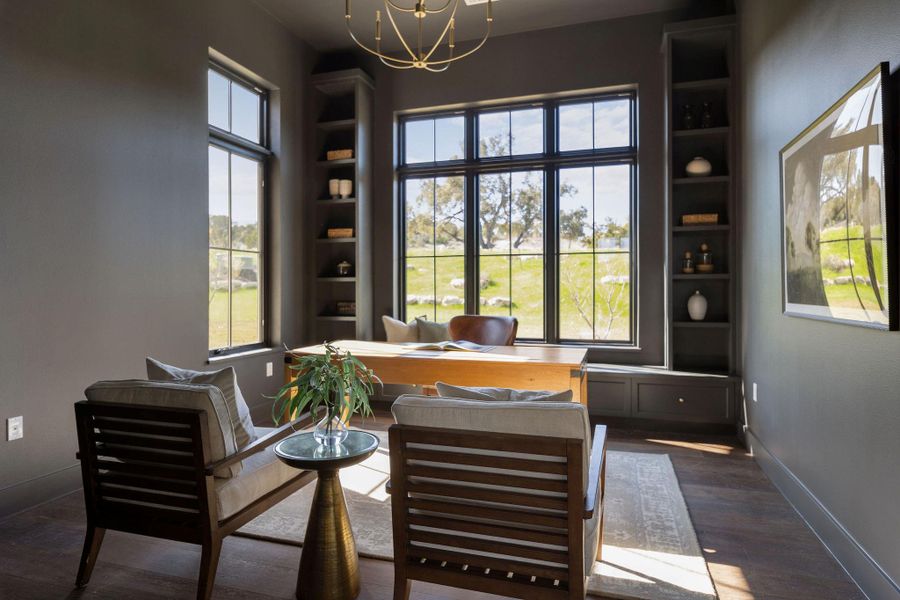 Study downstairs with built-in shelving and tons of natural light!