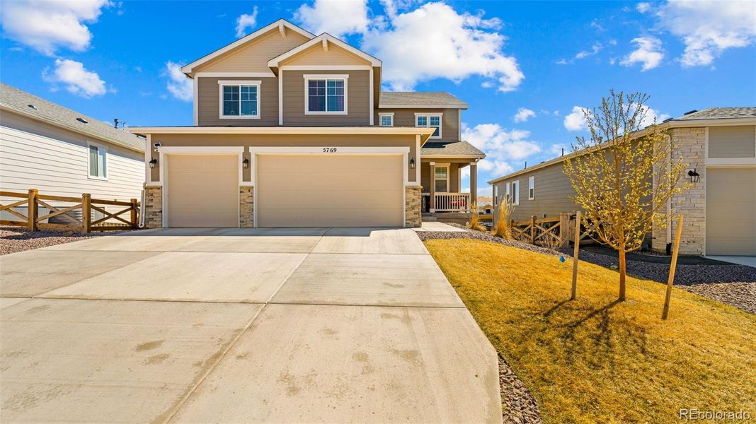 Front exterior of a new home in Banning Lewis Ranch, Colorado Springs, CO, highlighting curb appeal (Image 19).