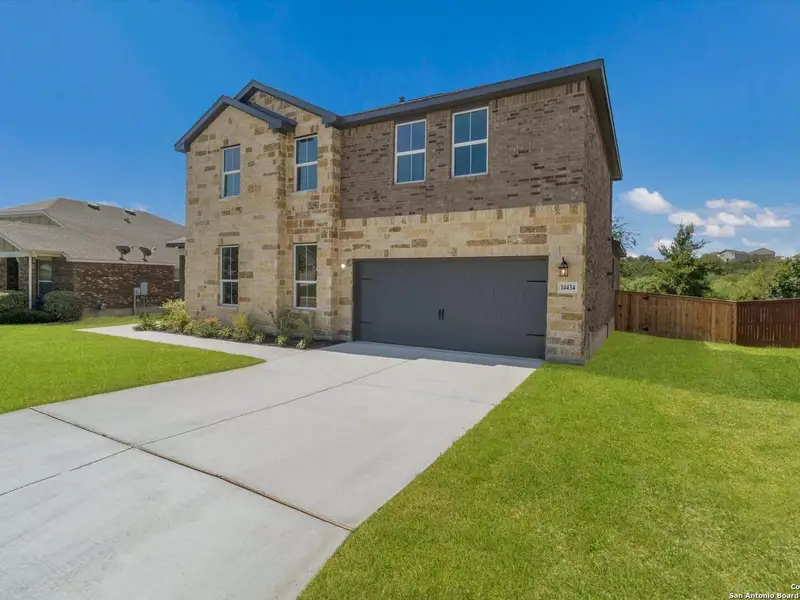 Front exterior of a new home in Ladera, San Antonio, TX, highlighting curb appeal (Image 2).