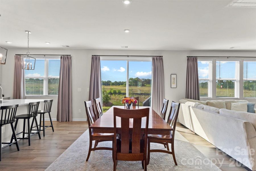 Dining area with views of backyard from 8' sliding patio doors. Dining area with views of backyard from 8' sliding patio doors.