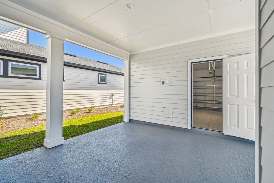 Exterior details and patio area of a home in Weslyn Park in Sunbridge 34', St. Cloud (Image 3). Exterior details and patio area of a home in Weslyn Park in Sunbridge 34', St. Cloud (Image 3).