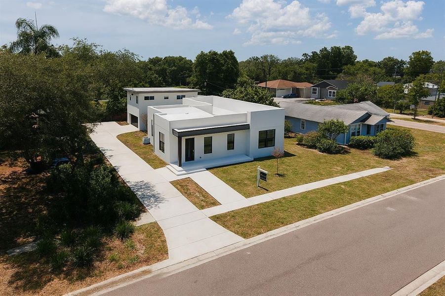 Front exterior of a new home in , St. Petersburg, FL, highlighting curb appeal (Image 27). Front exterior of a new home in , St. Petersburg, FL, highlighting curb appeal (Image 27).