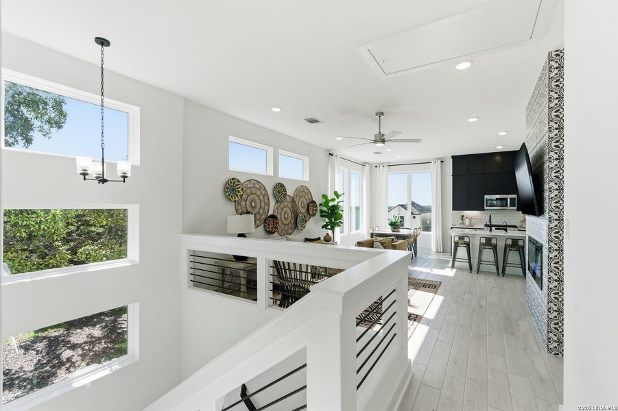 Furnished interior view inside a new home in Centero at Stone Oak, San Antonio (Image 30).