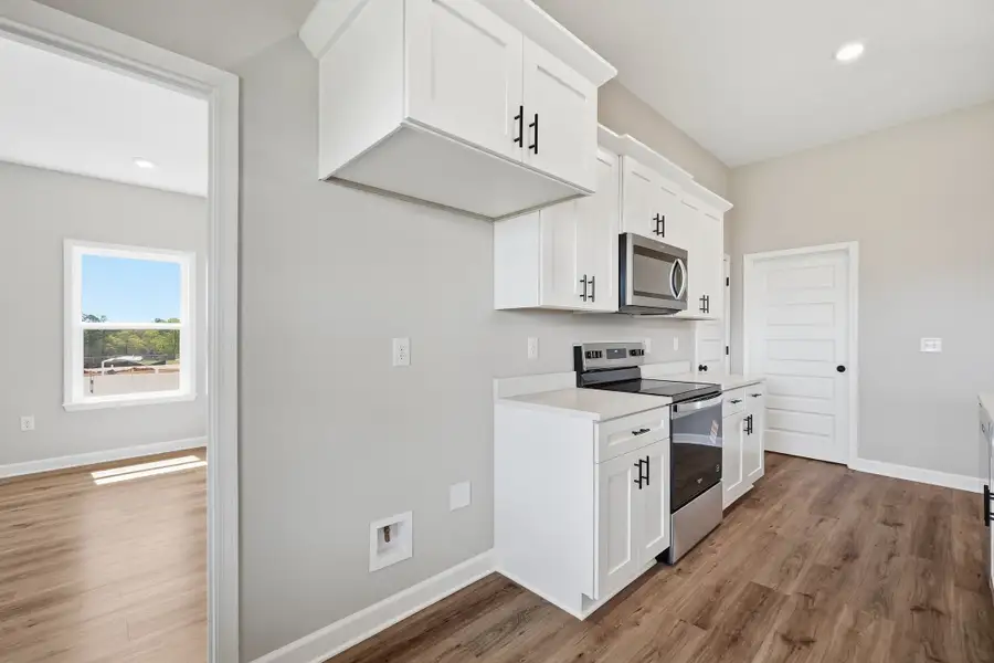 Furnished interior view inside a new home in Southern Charm, Crestview (Image 9).