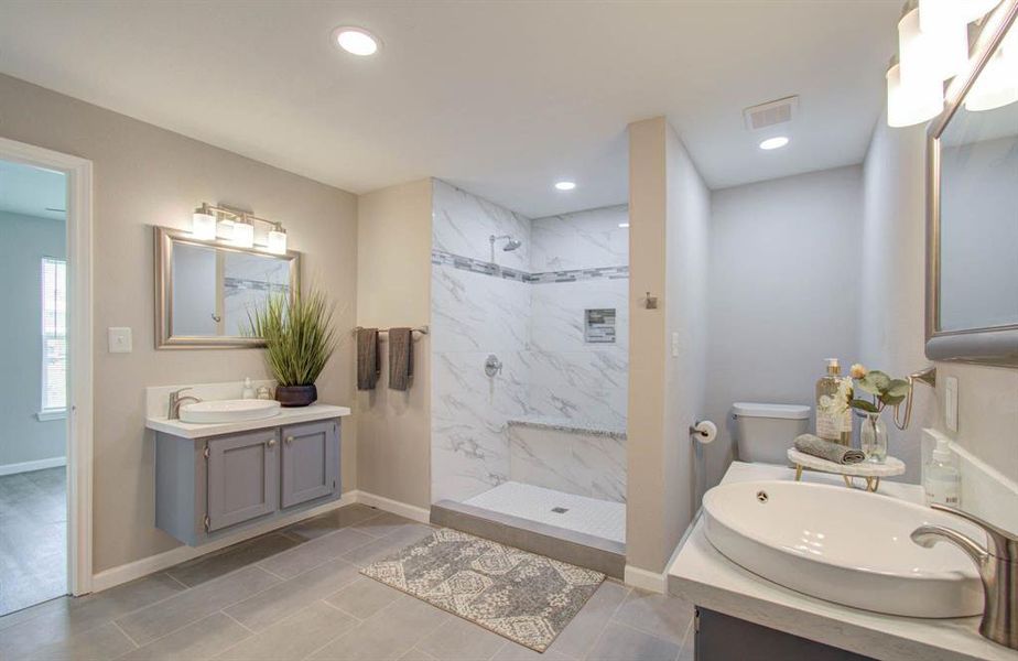 The full bath is fully upgraded and includes an extra wide shower, surrounded by LED recessed lighting, split dual vanities with full access to the third and fourth bedrooms