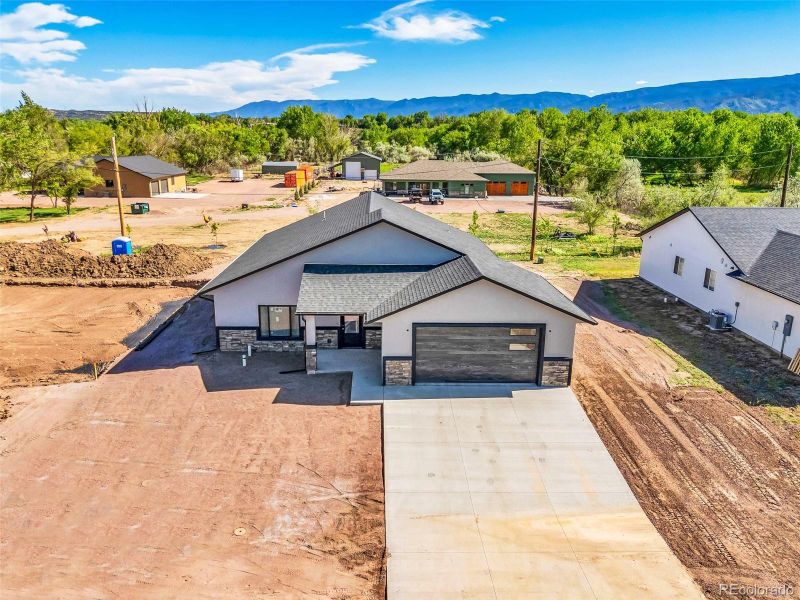 Front exterior of a new home in , Cañon City, CO, highlighting curb appeal (Image 22).