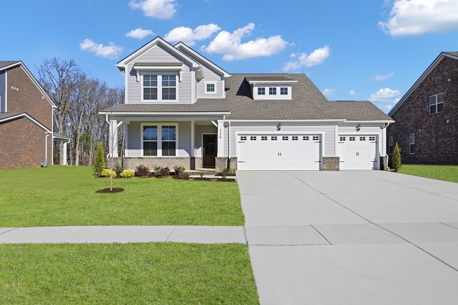 Front exterior of a new home in Knoll Creek, Lebanon, TN, highlighting curb appeal (Image 1). Front exterior of a new home in Knoll Creek, Lebanon, TN, highlighting curb appeal (Image 1).