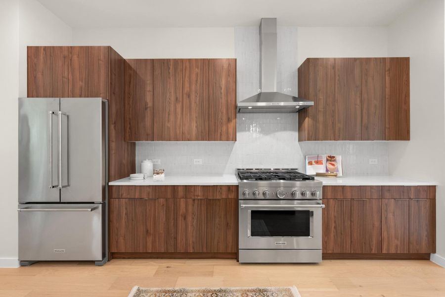 Culinary delights await in this modern kitchen with stainless steel appliances and sleek cabinetry. Culinary delights await in this modern kitchen with stainless steel appliances and sleek cabinetry.
