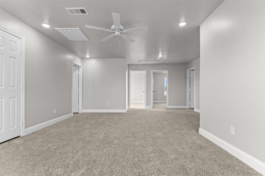 Unfurnished room featuring a ceiling fan, light colored carpet, recessed lighting, and baseboards Unfurnished room featuring a ceiling fan, light colored carpet, recessed lighting, and baseboards