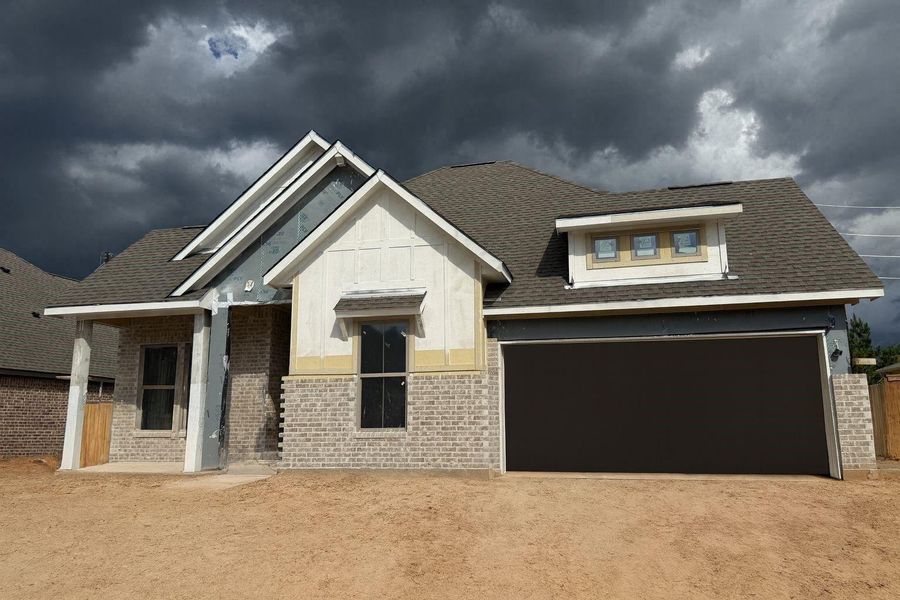 Front exterior of a new home in Escondido, Magnolia, TX, highlighting curb appeal (Image 1). Front exterior of a new home in Escondido, Magnolia, TX, highlighting curb appeal (Image 1).