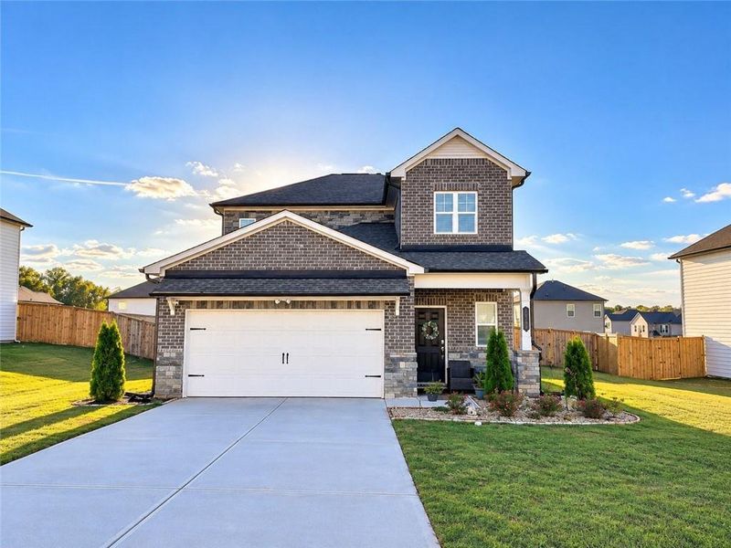 Front exterior of a new home in Heritage Point, Hampton, GA, highlighting curb appeal (Image 22).