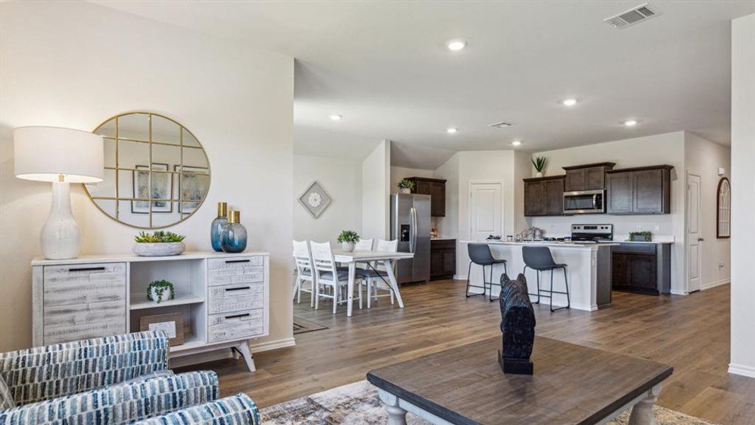 Living room featuring wood finished floors and recessed lighting